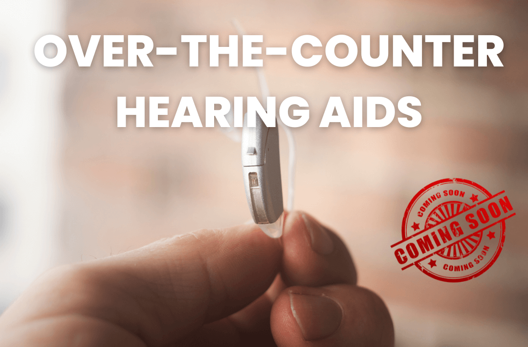 Hand holding a hearing aid
